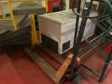 a picture of a stack of boxes and a forklift in a warehouse