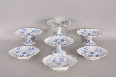 six blue and white plates with blue flowers on them