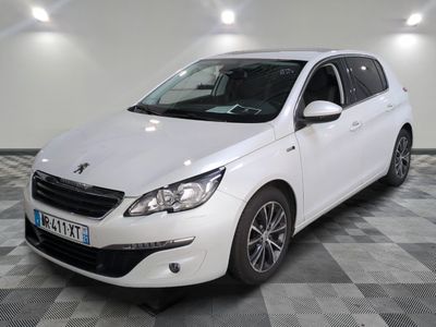 the white car is parked on a checkered floor in the garage