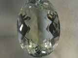 a close up of a green amethorate gemstone on a table