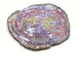 a picture of a piece of rock that has a colorful design on it