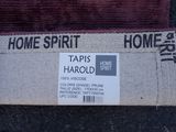 a picture of a home spirit label on a carpet