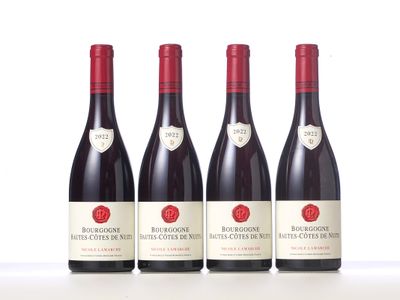 three bottles of red wine sitting on top of a white table