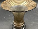 a glass bowl that is sitting on top of a table
