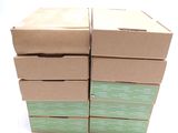 several boxes are stacked on top of each other on a white surface