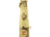 a picture of a bottle of wine that is wrapped in plastic