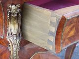a wooden table with a drawer on top of it