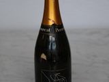 a bottle of champagne sitting on a marble table