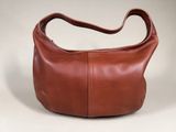 an image of a brown leather purse on a white background