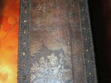 a wooden box with a metal design on it