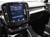 the interior of a car with a touch screen and steering controls