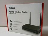 the box of the zyxel router is open on the table