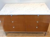 an image of a marble top chest of drawers on a hard wood floor