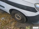 a white van with a black stripe on the side of it