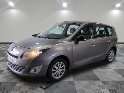 a picture of a silver car parked in a garage