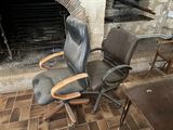 a chair that is sitting in front of a fire place