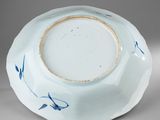 a blue and white bowl sitting on a table