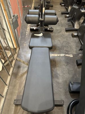 a row of exercise equipment in a gym room