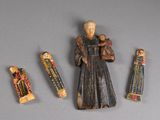 a figurine of a man holding a baby and three other figurines