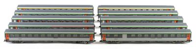 four train cars that are stacked on top of each other
