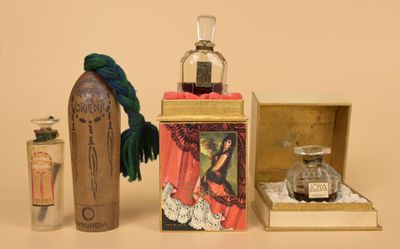 a bottle of perfume and a box of perfumes on a table
