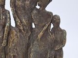 statue of a group of people with a child and a dog