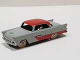 a toy car that is sitting on a white surface