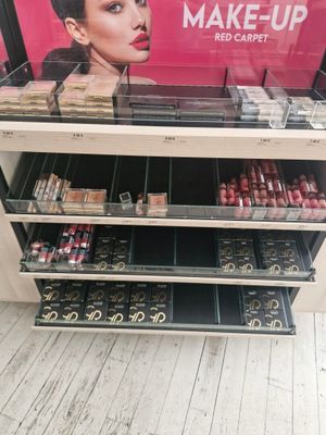 a display of makeup products for sale in a store
