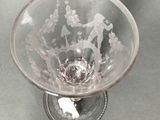 a glass bowl with a design on it sitting on a table