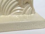 a white statue of a horse on a white surface