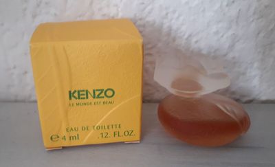 an image of a bottle of kenzo next to a box of perfume
