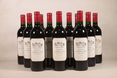 six bouteilles de vin rouge sont alignées