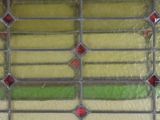 an image of a stained glass window with red, yellow, and green squares