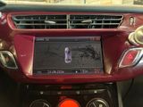 a red car dashboard with a digital display on it