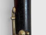 a close up of a saxophone with a bell on it
