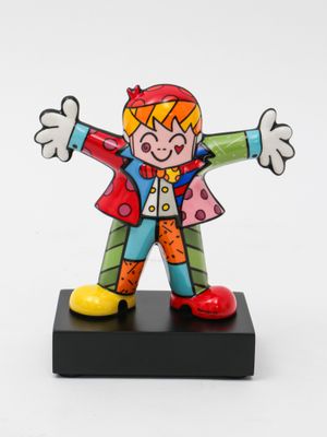 statue of a clown on a black base with a white background