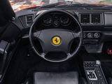 the interior of a black sports car with a steering wheel and dashboard