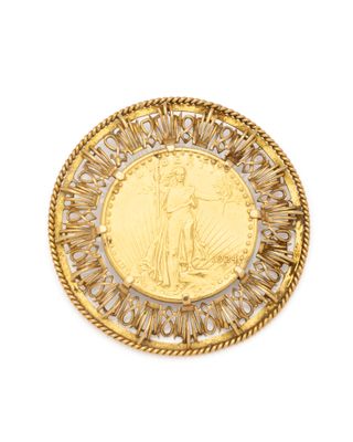 a gold coin with an image of a saint on it