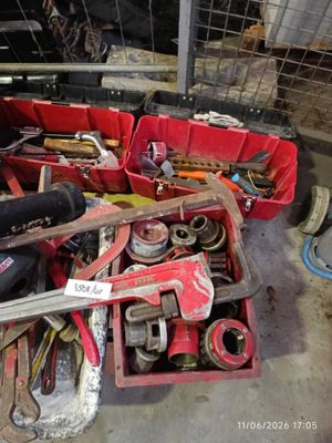 many tools in a red box in a garage
