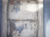 a picture of a dirty refrigerator in a dirty room