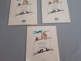 three children ' s books on a table with a blue table cloth