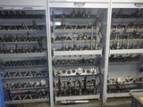 many different types of tools on the shelves in this room