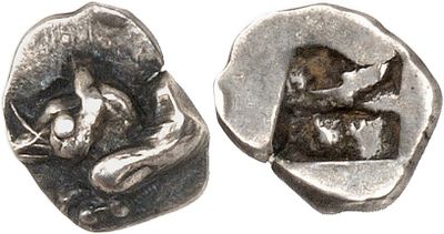 silver coin with image of a woman and a cat on it