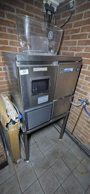 an image of a kitchen with a stove and a trash can
