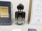 a bottle of perfume next to a box of perfume