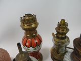 three different types of lamps on a white surface