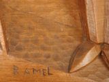a close up of a wooden statue of a man