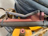 a close up of a pipe cutter on a machine