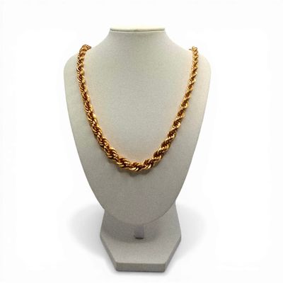 necklace on a mannequin with a gold chain on a white mannequin
