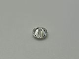 a close up of a single diamond on a white surface
